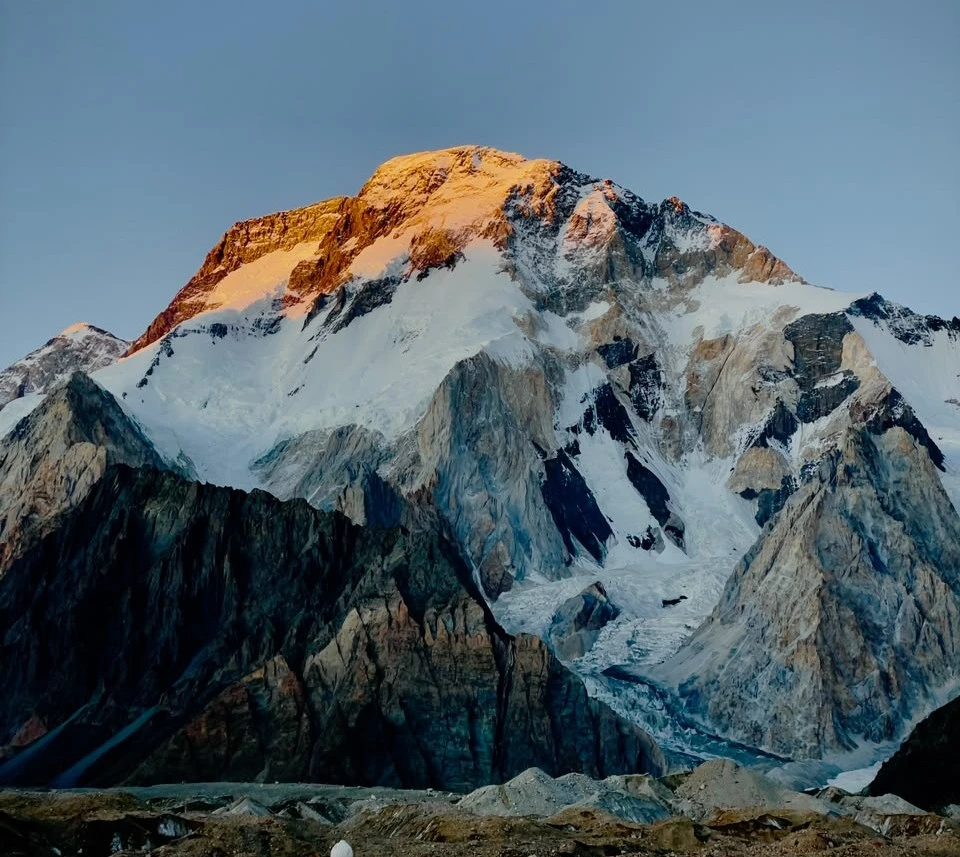 Snow-capped Karakoram peaks under a dramatic sky in Hunza Nagar, Pakistan